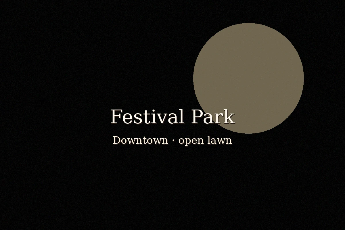Open lawn and stage pavilion at Festival Park in downtown Fayetteville